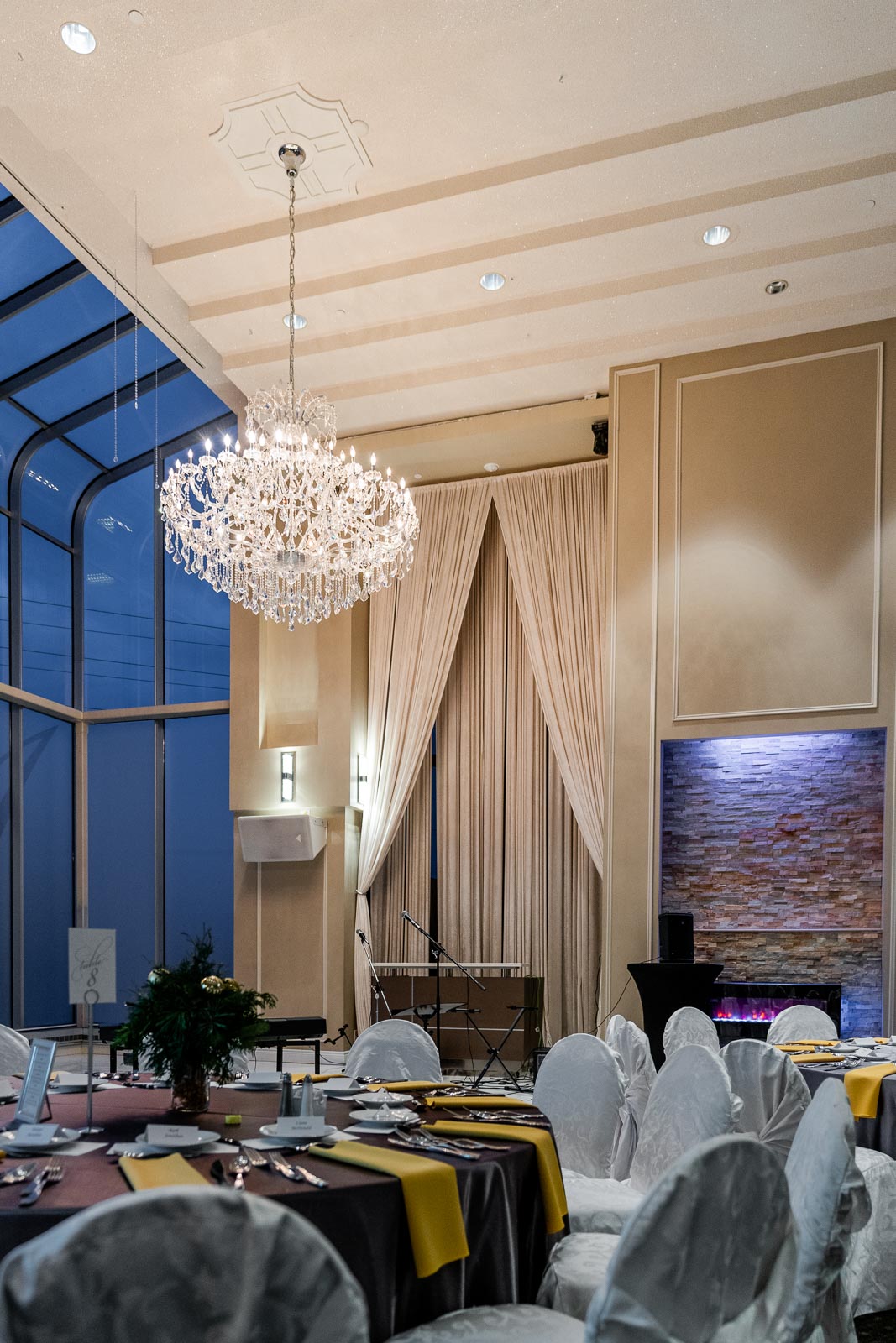 A large event room with a giant chandelier.